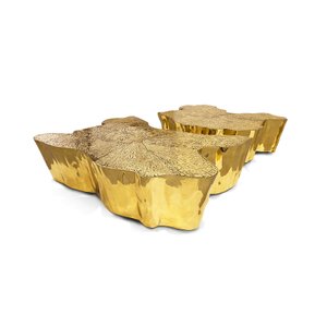 طاولة قهوة معدنية بتصميم جذع شجرة من الفولاذ المقاوم للصدأ باللون الذهبي الشهير